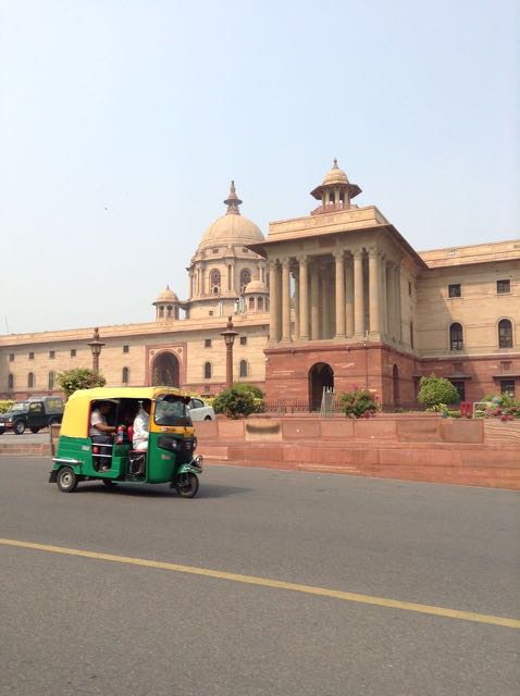 Tuk-tuk in front of government building